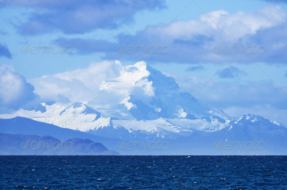 distant Mount Sarmiento looms above the Strait of Magellan in Patagonia Chile