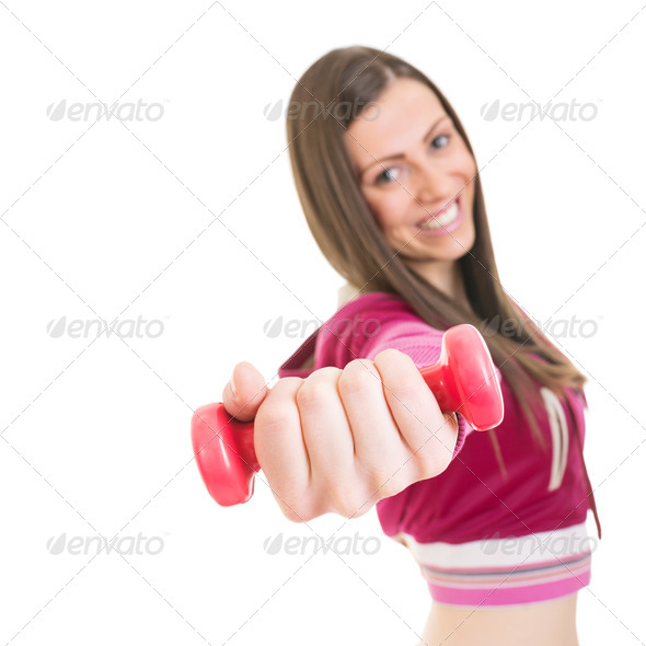 Happy young woman working out with pink dumbbell - Stock Photo - Images