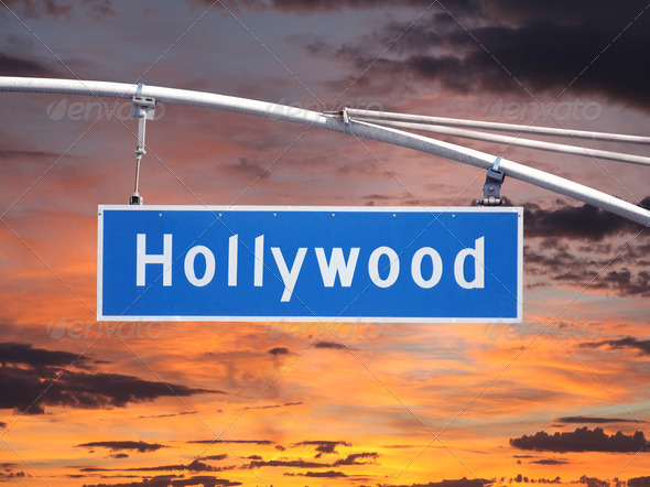 Hollywood Blvd overhead street sign with sunset sky.