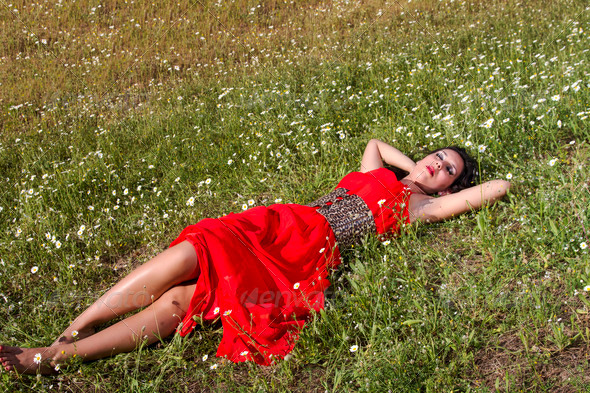 young woman in a red dress sleeping