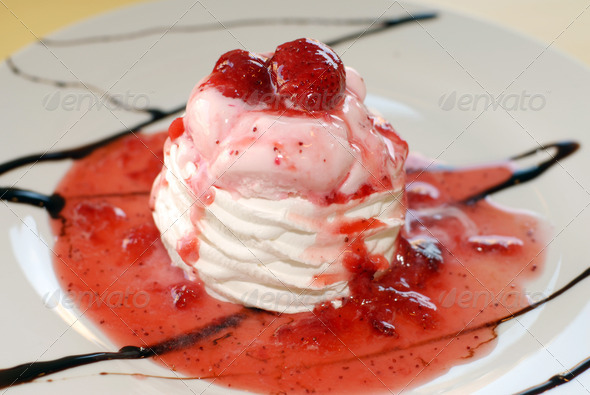 Sweet cold frozen vanilla ice cream and strawberry sauce dessert food.