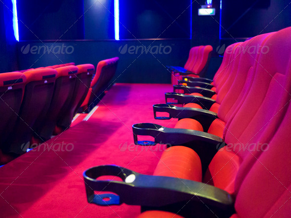 Red seats of cinema hall after the movie