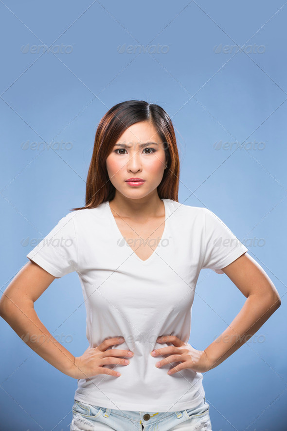 Portrait of an angry looking Asian Woman.