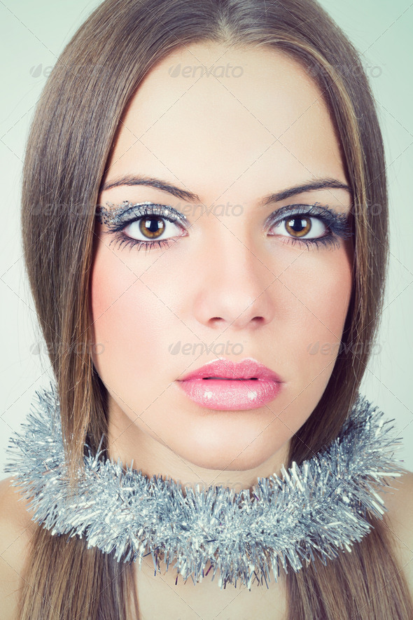 Beautiful young woman wearing glittery makeup - Stock Photo - Images