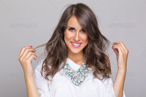 Beautiful casual woman wearing a fashionable necklace - Stock Photo - Images