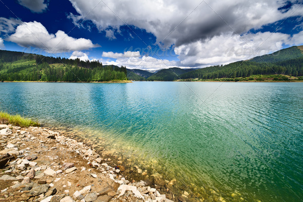 Dam Lake Bolboci in Bucegi mountains, Romania - Stock Photo - Images