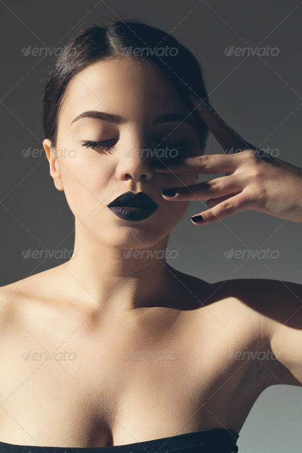 Fashionable attractive woman with black lipstick - Stock Photo - Images