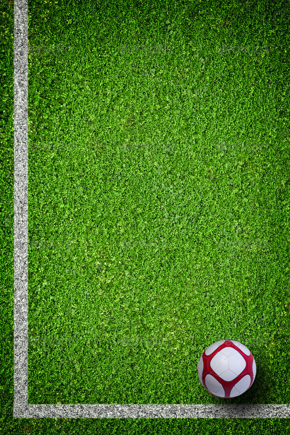 Closeup image of soccer football ball on green grass