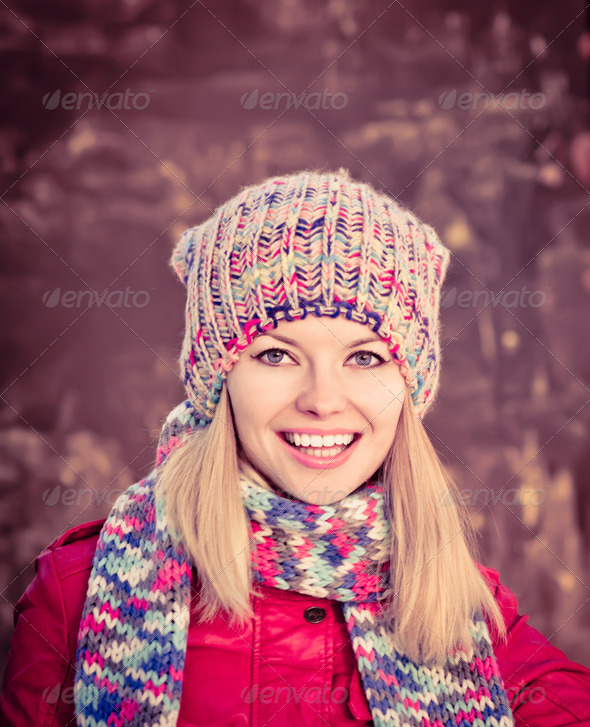 Winter Woman Beautiful happy smiling Face wearing knitted hat and scarf