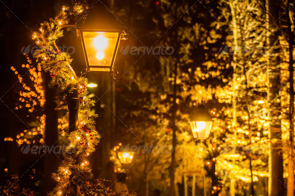street lights decorated for christmas in a city village