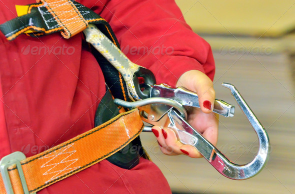 woman and a fall protection harness