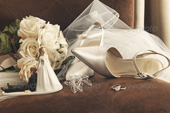 Bouquet of white roses and wedding shoes on chair - Stock Photo - Images