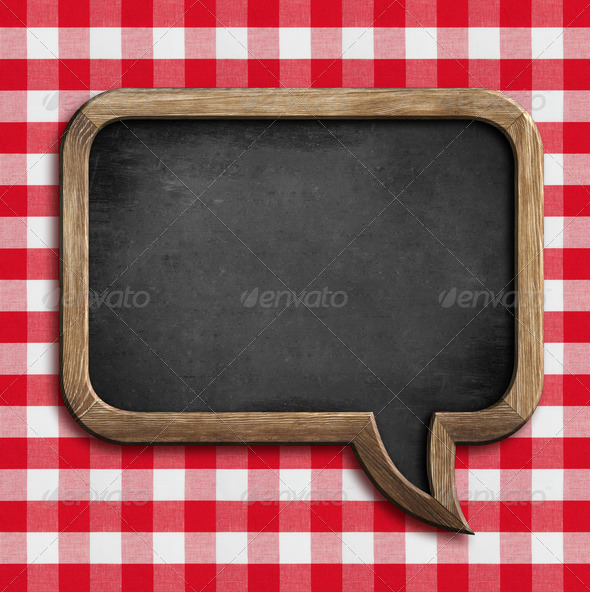 menu chalkboard speech bubble on table with picnic tablecloth