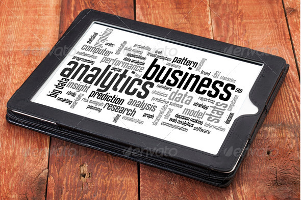 business analytics word cloud – a digital tablet on a rustic wooden table