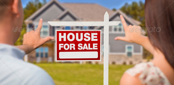 For Sale Real Estate Sign, House and Military Couple Framing Hands in Front.