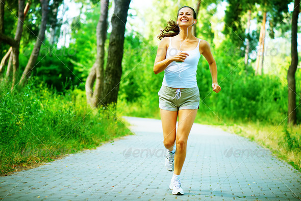 Running Woman. Outdoor Workout in a Park