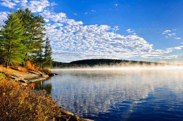 Autumn lake shore with fog - Stock Photo - Images