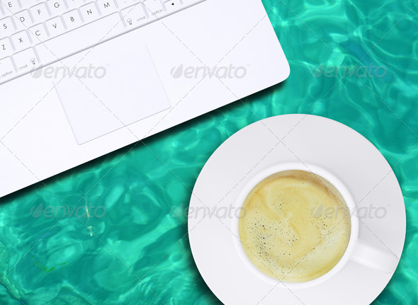 Laptop and coffee cup on water surface (Misc) Photo Download