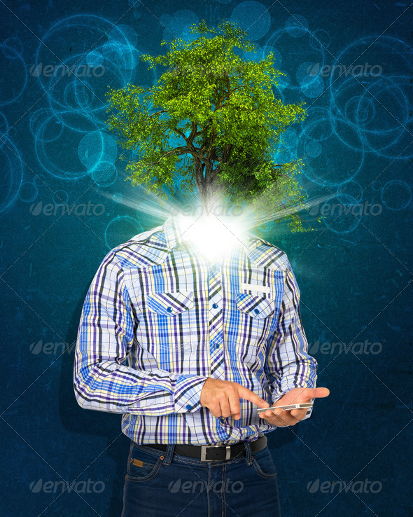 Man hold smart phone. Green tree and bright light instead his head (Misc) Photo Download