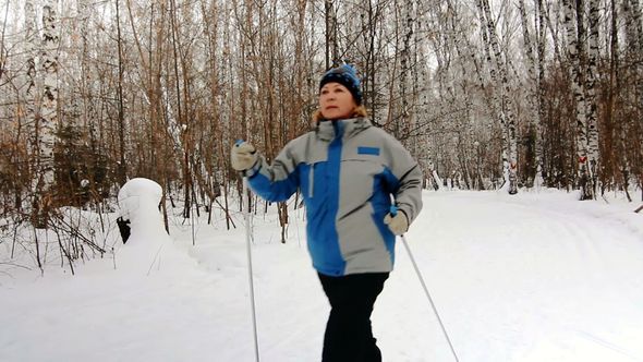Nordic Walking adult woman in winter Nordic Walking adult woman in winter