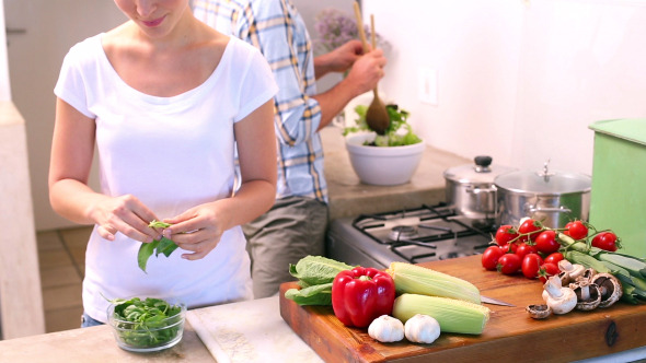 Happy Young Couple Cooking Together 1 Happy Young Couple Cooking Together 1