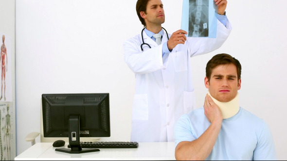 Doctor Showing Xray To Injured Patient Doctor Showing Xray To Injured Patient