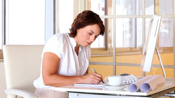 Businesswoman Working At Her Desk 3 Businesswoman Working At Her Desk 3
