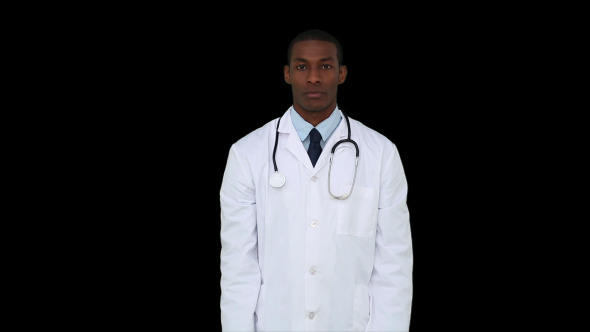 Serious Young Doctor Showing Tablets To Camera 1 Serious Young Doctor Showing Tablets To Camera 1