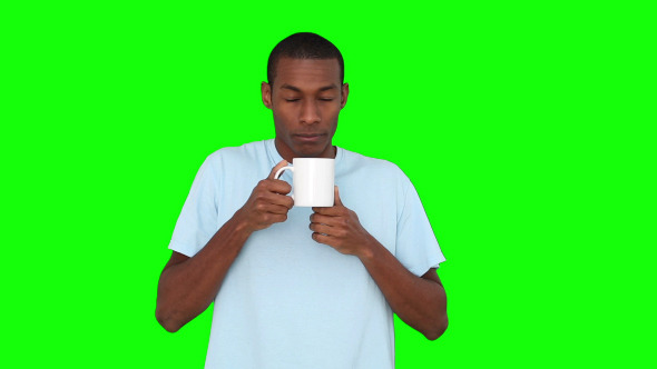 Casual Young Man Enjoying Cup Of Coffee 2 Casual Young Man Enjoying Cup Of Coffee 2