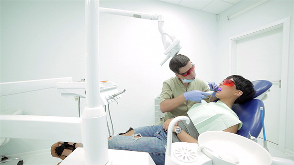 The Patient Wears Red Dental Protective Mask The Patient Wears Red Dental Protective Mask
