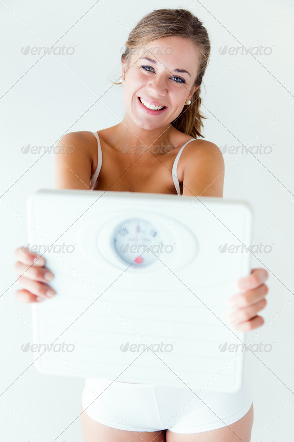 Young girl in underwear holding scales. (Misc) Photo Download