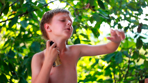 Handsome Young Man Applying Deodorant Handsome Young Man Applying Deodorant