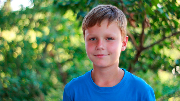 Portrait Of Happy Kid Looking At Camera Portrait Of Happy Kid Looking At Camera