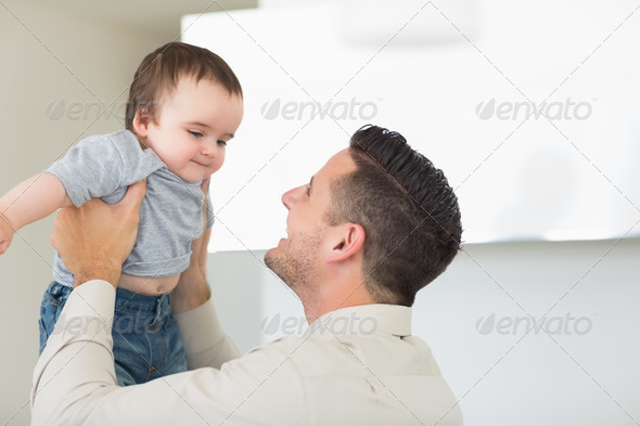 Happy father playing with cute baby boy at home (Misc) Photo Download