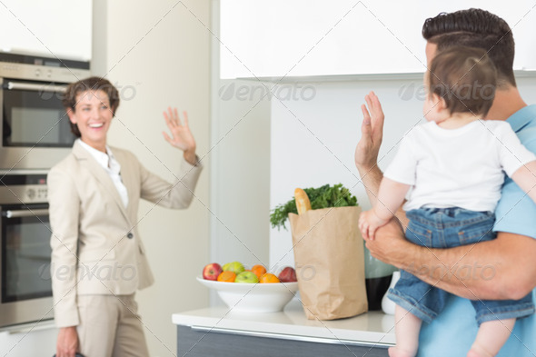 Family waving goodbye to smiling businesswoman (Misc) Photo Download