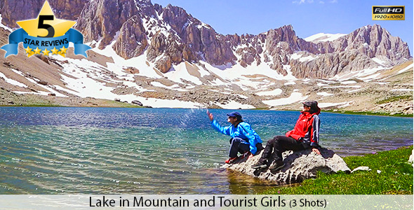 Two Girls Sitting Near The Mountain Lake Two Girls Sitting Near The Mountain Lake