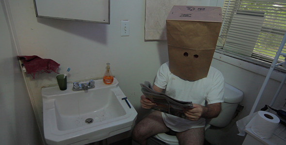 Unknown Masked Man Reads Newspaper Unknown Masked Man Reads Newspaper