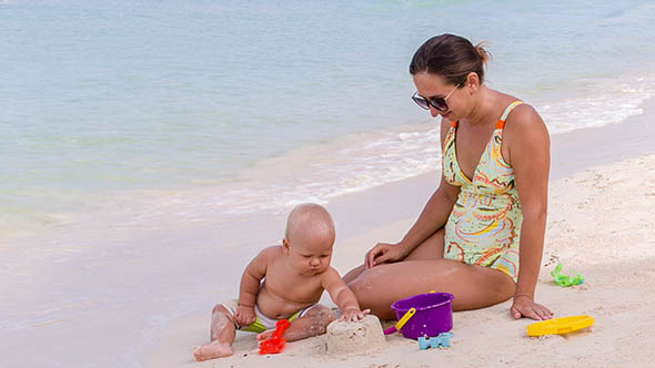 Baby and Mother on the Tropical Beach Baby and Mother on the Tropical Beach
