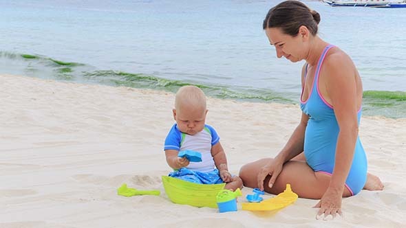 Baby and Mom Playing Beach Toys Baby and Mom Playing Beach Toys