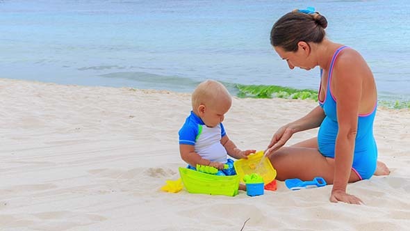 Baby and Mom Playing Beach Toys Baby and Mom Playing Beach Toys