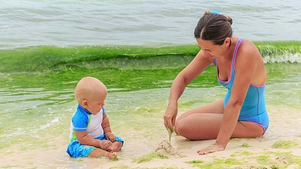 Baby and Mother on the Tropical Beach Baby and Mother on the Tropical Beach