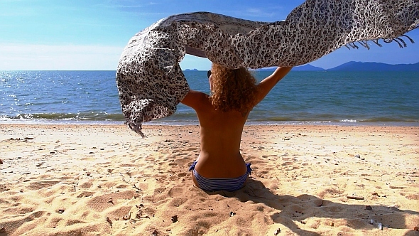 Woman with Pareo on the Beach in Slow Motion Woman with Pareo on the Beach in Slow Motion