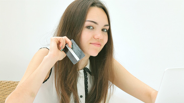 Young and Pretty Girl Making Online Purchases Young and Pretty Girl Making Online Purchases