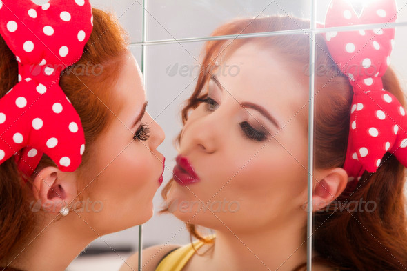 beautiful redhead girl with colorful pinup clothes