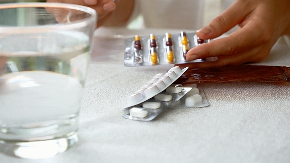 Woman with Packings of Pills Woman with Packings of Pills
