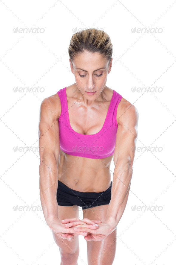 Female bodybuilder flexing with hands together on white background (Misc) Photo Download