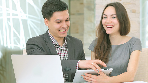 Confident Young People Work for the Tablet Confident Young People Work for the Tablet