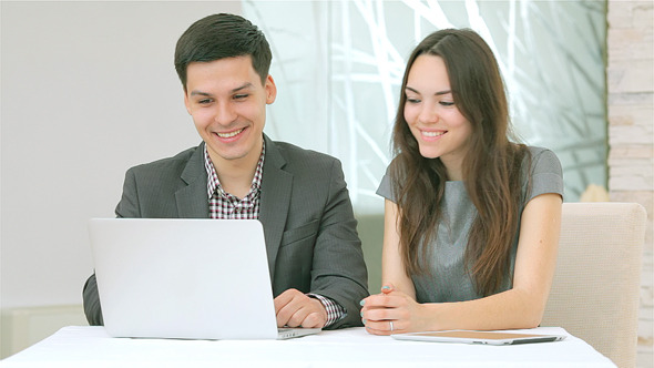 Confident Young People Work for the Tablet Confident Young People Work for the Tablet