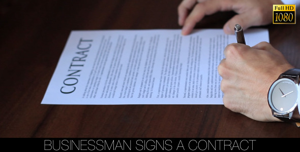 Businessman Signs a Contract Businessman Signs a Contract