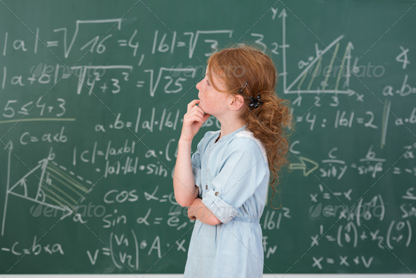 Thoughtful young girl in mathematics class